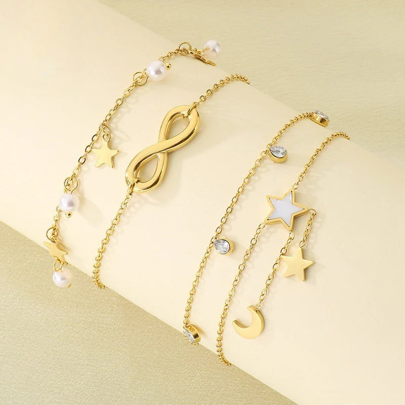 Infinity & Celestial Charm Bracelet – Gold Tone