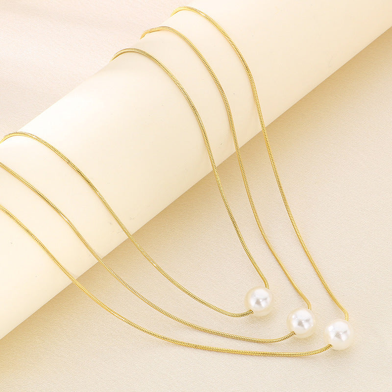 Cold wind high-grade titanium steel three-layer stacking wearing wind comes and goes round beads pearl titanium steel snake bone chain necklace necklace item decoration