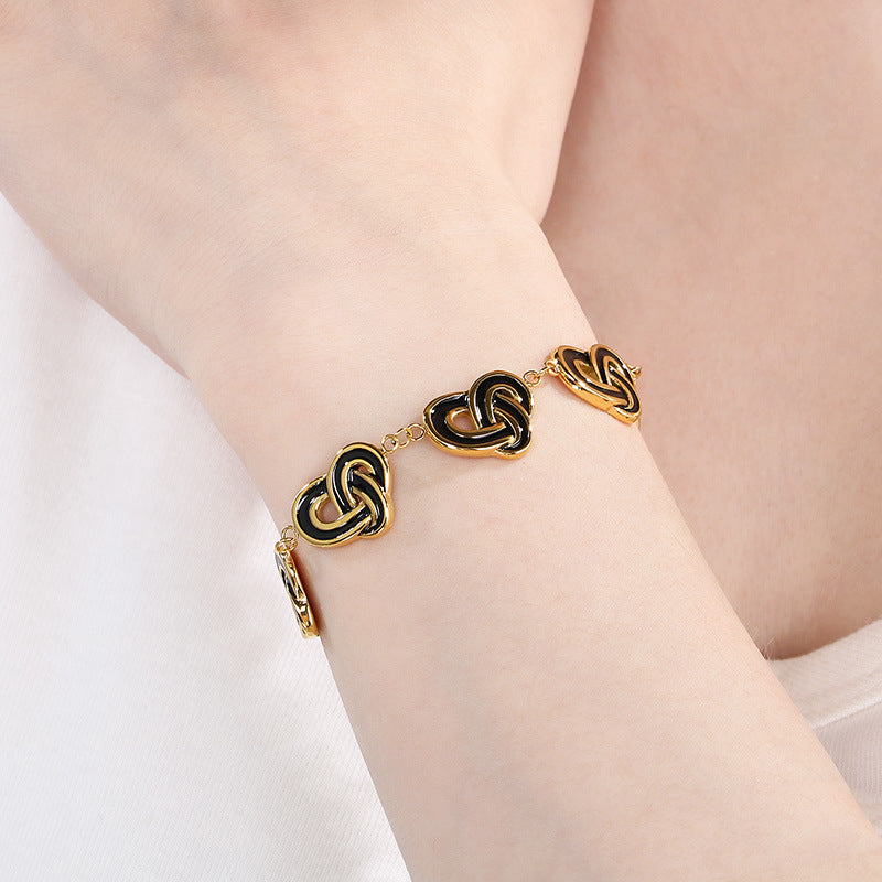 Simple temperament, retro oil dripping stainless steel winding heart-shaped OT buckle bracelet, fashionable light luxury, high-end hand jewelry, spot