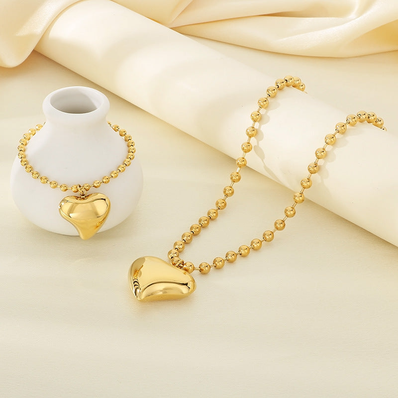 Cross-border fashion stainless steel love pendant jewelry simple titanium steel round bead neck chain bracelet versatile jewelry two-piece set