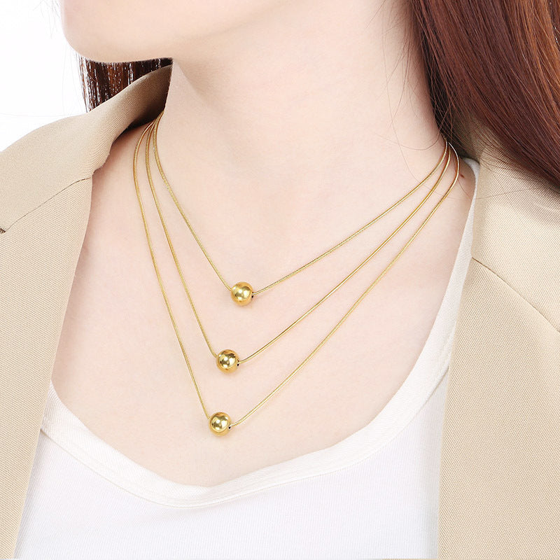 Cold wind high-grade titanium steel three-layer stacking wearing wind comes and goes round beads pearl titanium steel snake bone chain necklace necklace item decoration