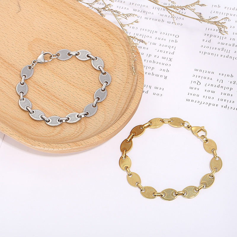 Simple high-end sense versatile fashion coffee bean pig nose stainless steel plated 18K gold titanium steel bracelet spot