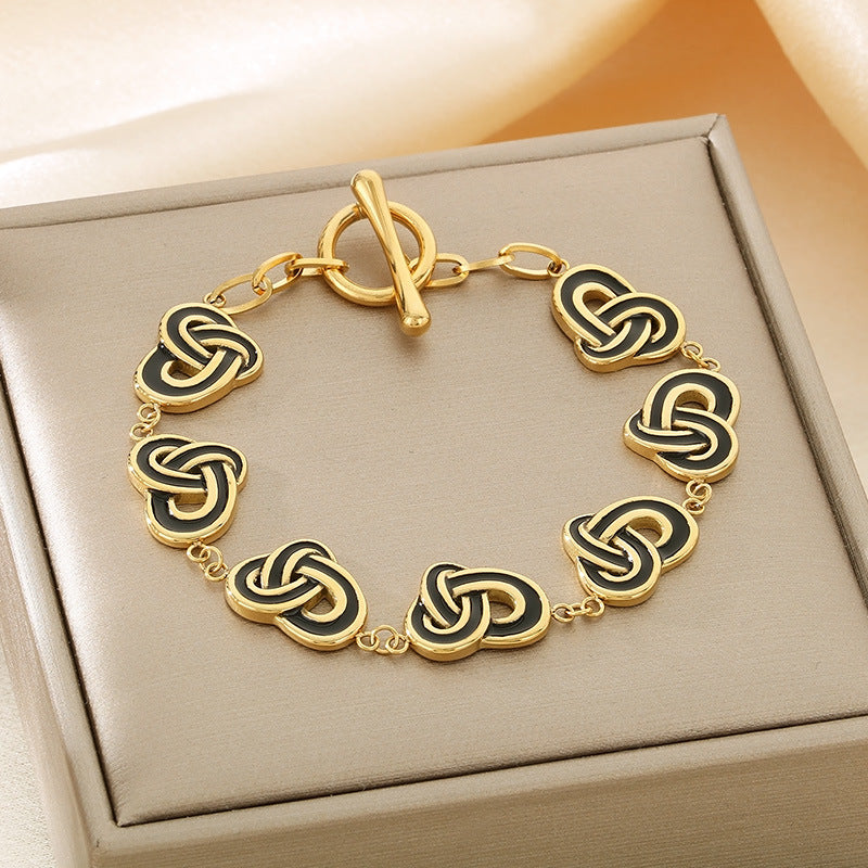 Simple temperament, retro oil dripping stainless steel winding heart-shaped OT buckle bracelet, fashionable light luxury, high-end hand jewelry, spot