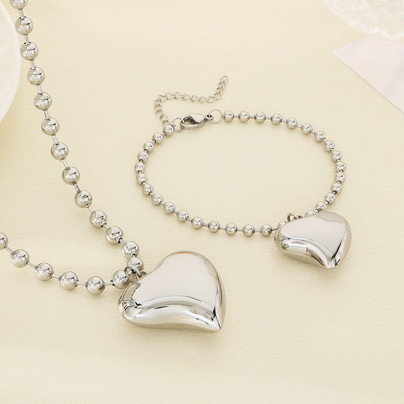 Cross-border fashion stainless steel love pendant jewelry simple titanium steel round bead neck chain bracelet versatile jewelry two-piece set