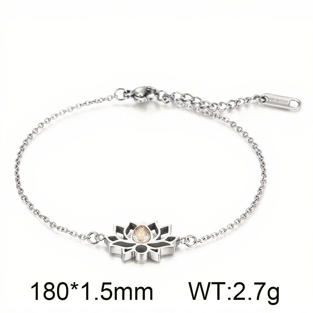 Cross-border new stainless steel zircon lotus set, creative hollow flower water drop stone pendant jewelry three-piece set