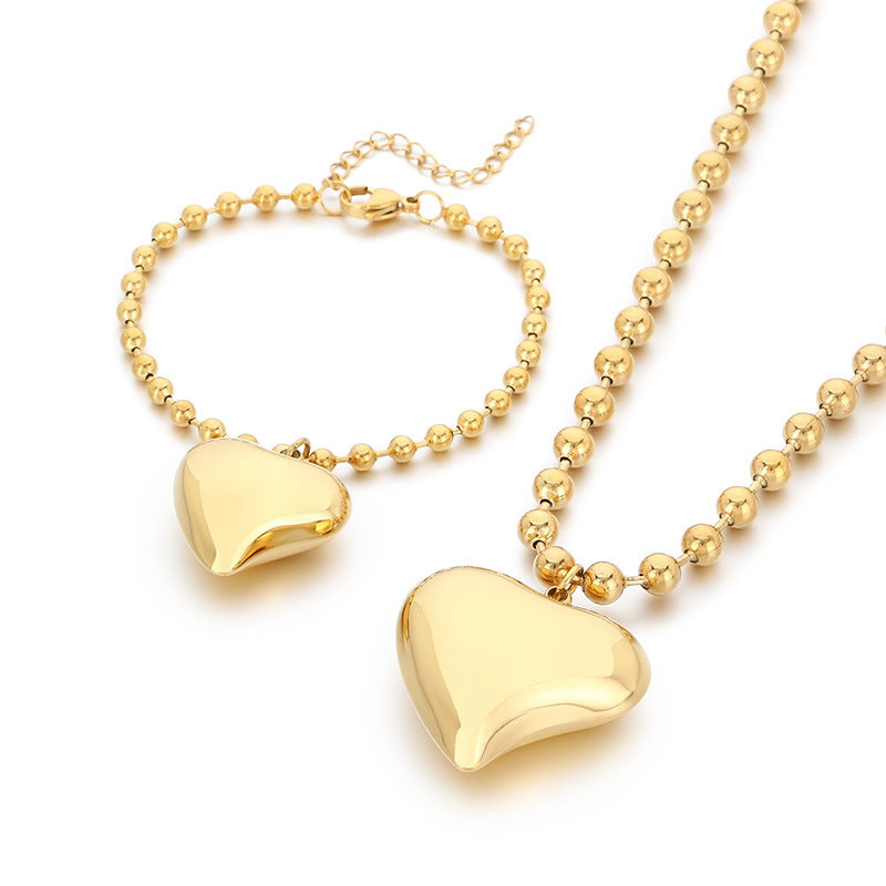 Cross-border fashion stainless steel love pendant jewelry simple titanium steel round bead neck chain bracelet versatile jewelry two-piece set