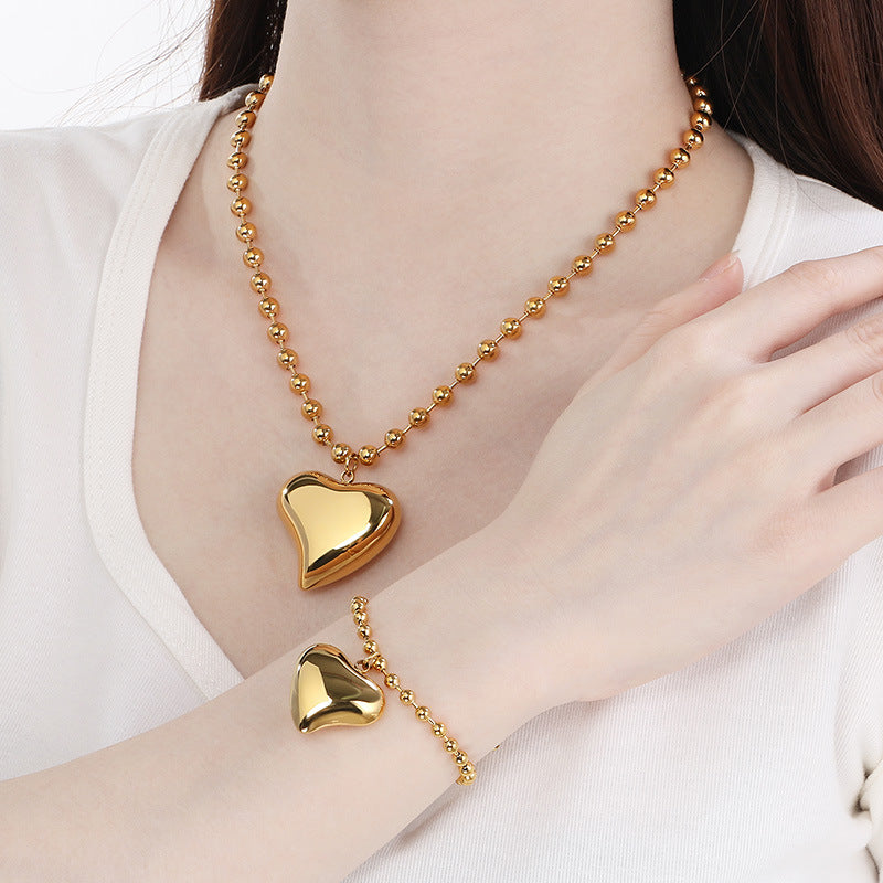Cross-border fashion stainless steel love pendant jewelry simple titanium steel round bead neck chain bracelet versatile jewelry two-piece set