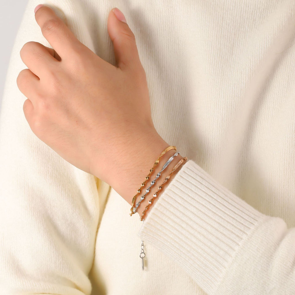 Stainless steel twist push tight bracelet women's European and American trend fashion furnace 18K vacuum plating titanium steel bracelet wholesale