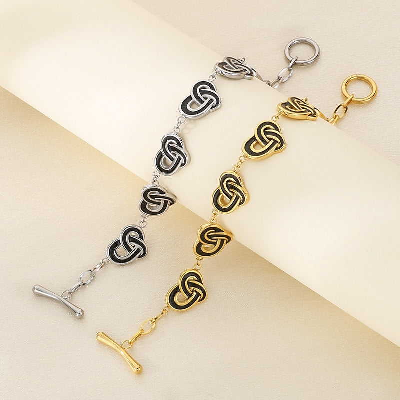 Simple temperament, retro oil dripping stainless steel winding heart-shaped OT buckle bracelet, fashionable light luxury, high-end hand jewelry, spot