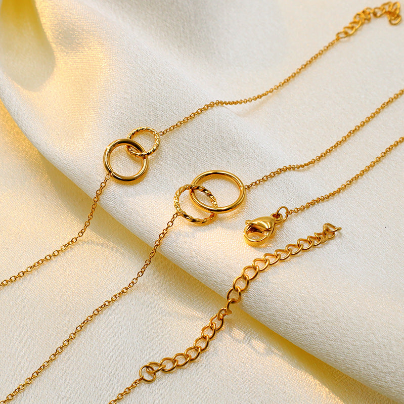 Cross-border new double ring pendant necklace titanium steel electroplated 18K gold ring ring interlocking collarbone chain women's ins jewelry wholesale