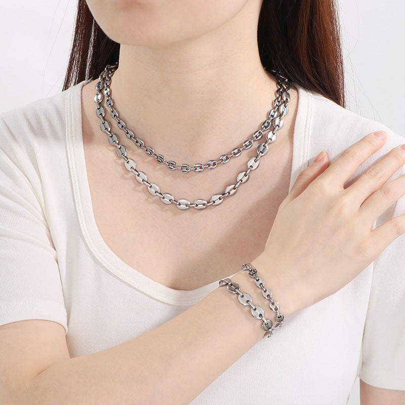 Simple high-end stainless steel pig nose coffee bean bracelet necklace chain vacuum 18k gold pig nose chain set