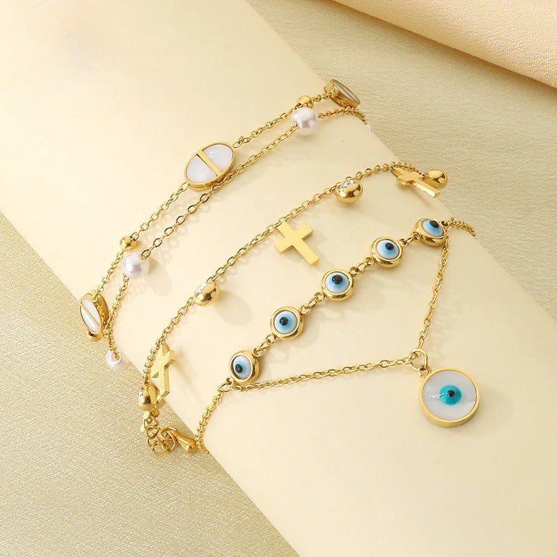 Evil Eye & Cross Charm Bracelet – Gold Tone
